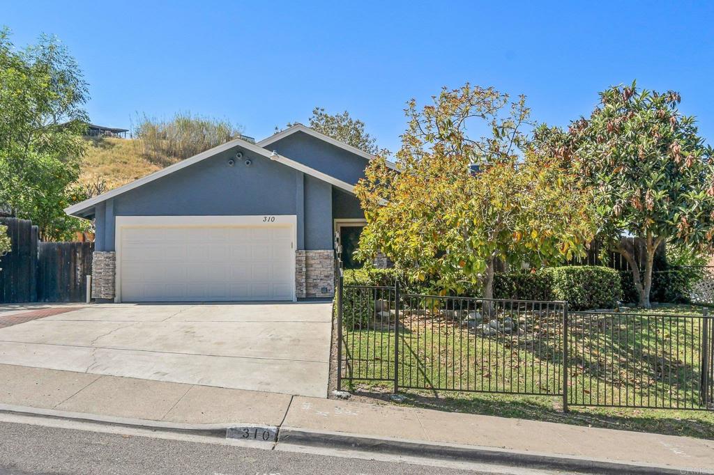 310 Worthington Street Spring Valley, CA 91977 - Photo 1 of 1 a front view of a house with a garden