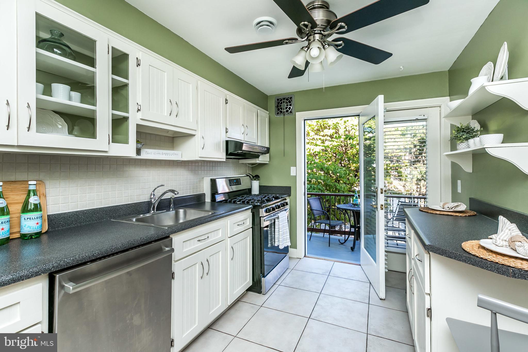 433 Academy Road Baltimore, MD 21228 - Photo 13 of 41 Stylish white cabinetry & tile backsplash