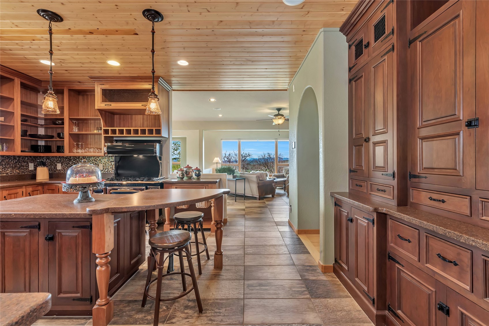 31485 Deerwood Ranch Road Steamboat Springs, CO 80487 - Photo 28 of 49 a kitchen with stainless steel appliances granite countertop a stove a sink dishwasher and a refrigerator with wooden floor