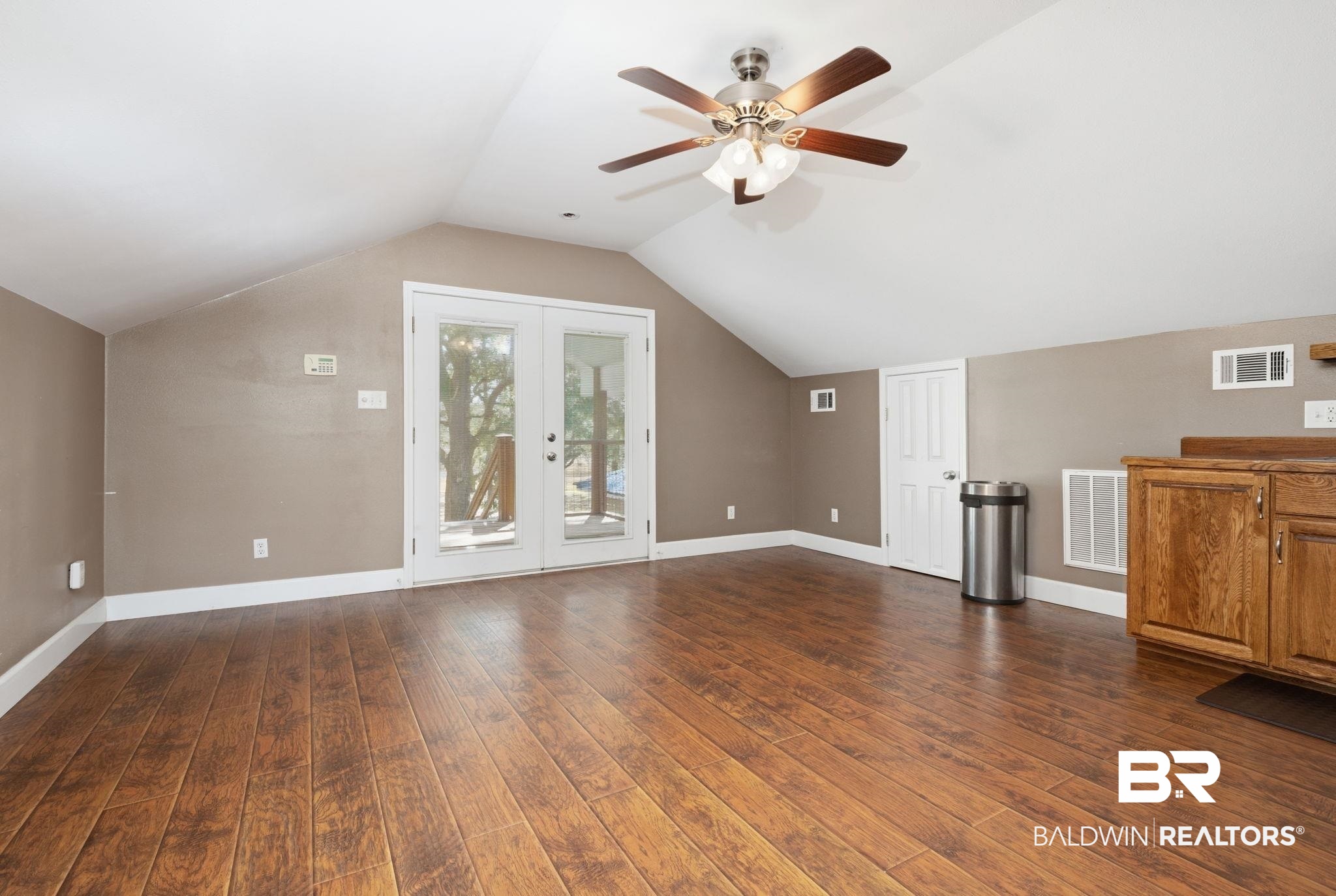 15025 Bellingrath Road Coden, AL 36523 - Photo 65 of 79 Additional living space featuring french doors, ceiling fan, and dark wood finished floors