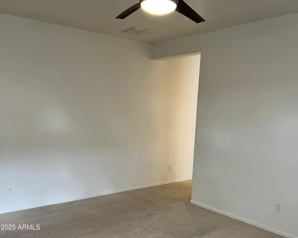 a bathroom with a granite countertop sink and a bathtub