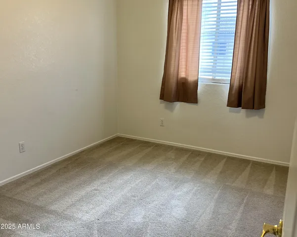 an empty room with an entrance door