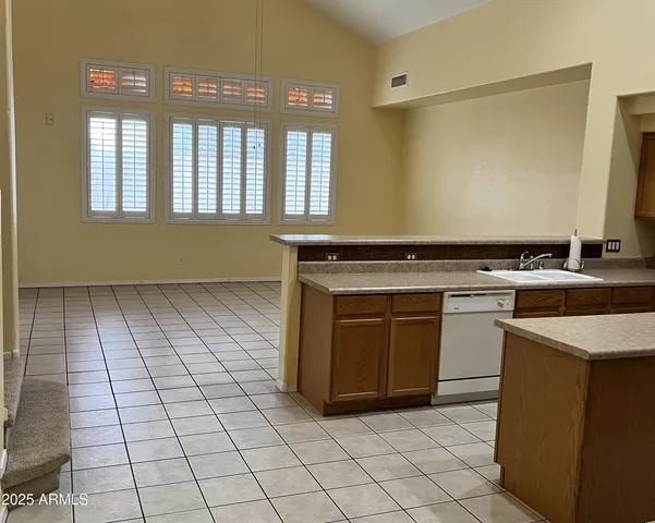 a kitchen with a stove top oven and cabinets
