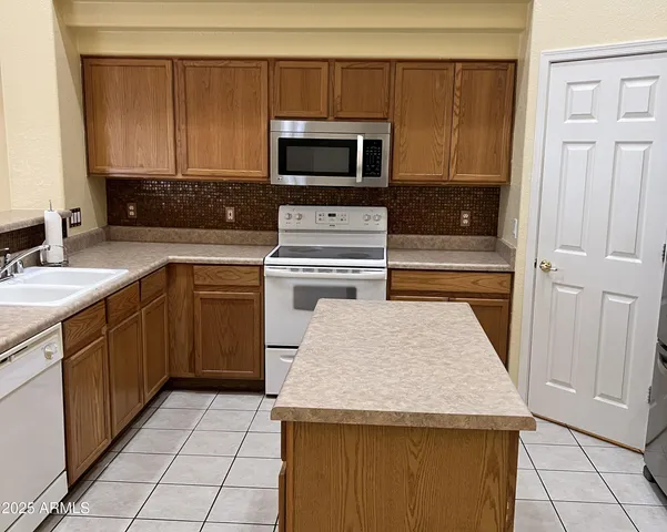 a bathroom with a sink a toilet and vanity