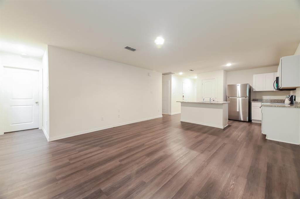 510 East Shepherd Street Denison, TX 75021 - Photo 5 of 21 a view of kitchen with wooden floor