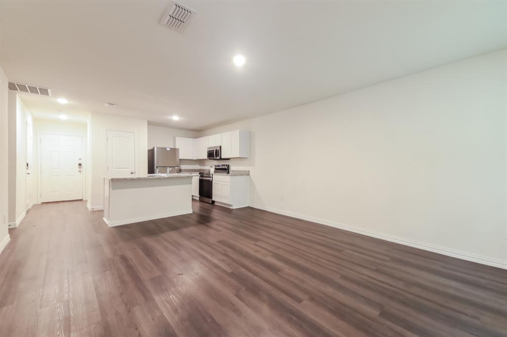 510 East Shepherd Street Denison, TX 75021 - Photo 6 of 21 a view of a kitchen with wooden floor