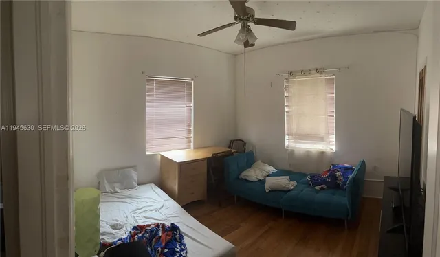a bathroom with a bathtub sink vanity and toilet