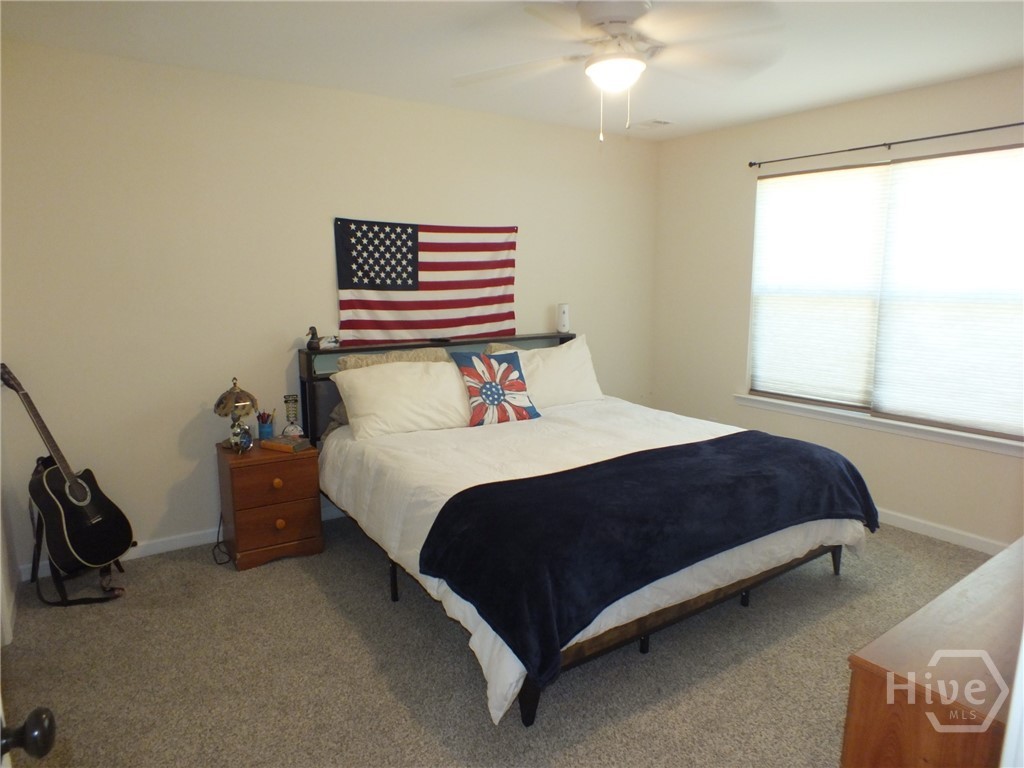 102 Black Pine Drive Springfield, GA 31329 - Photo 4 of 13 Large Owners Suite. This is a king sized bed! Bathroom boasts soaking tub, shower combination. A Huge walk in closet, and double vanity.