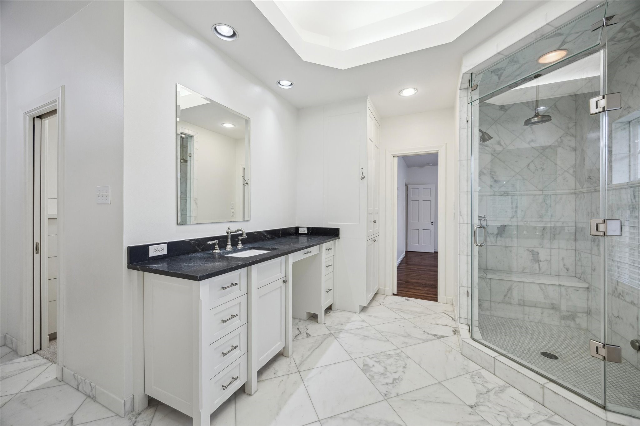 2440 Inwood Drive Houston, TX 77019 - Photo 15 of 25 a bathroom with a granite countertop sink mirror and shower