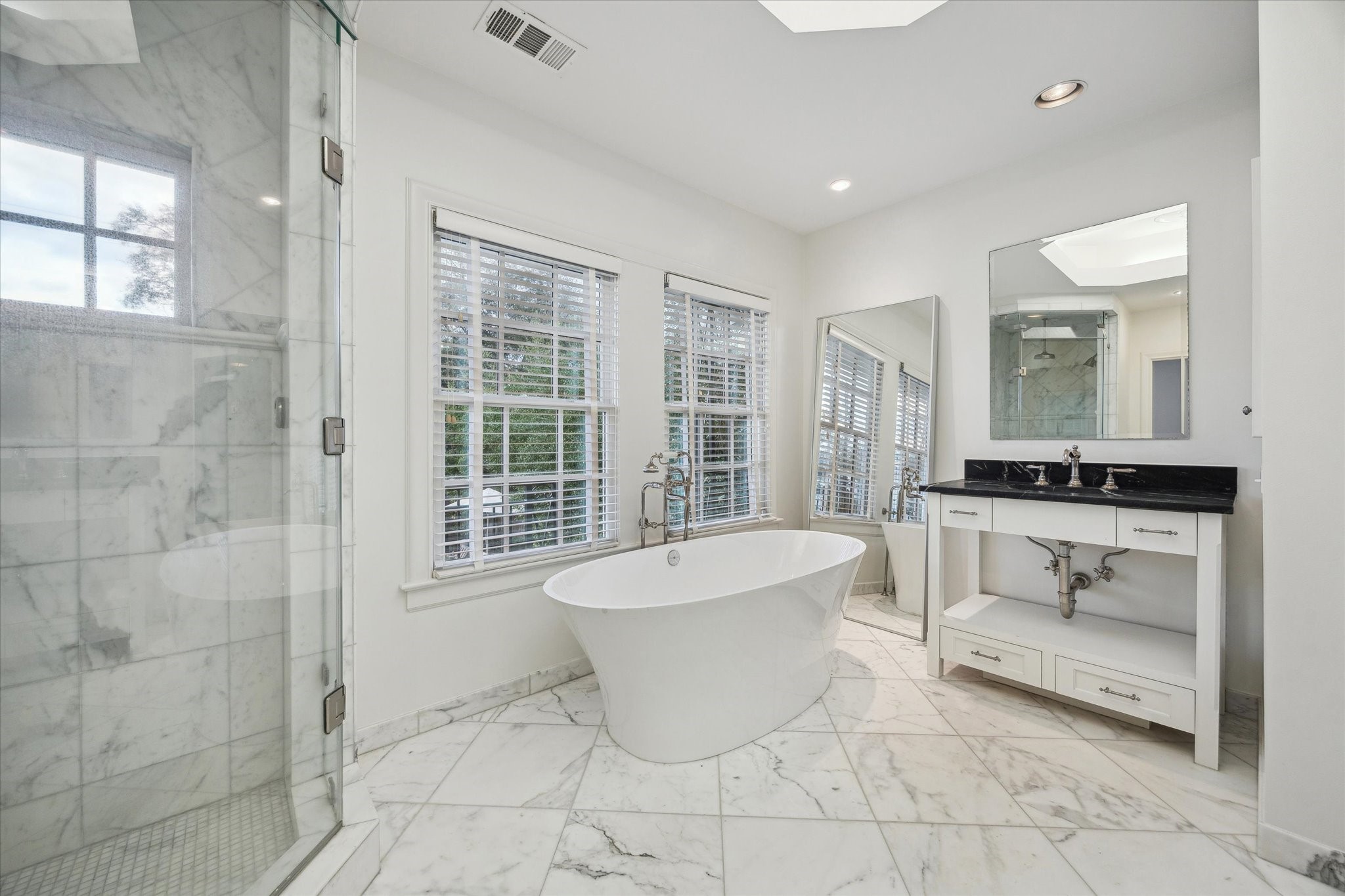 2440 Inwood Drive Houston, TX 77019 - Photo 16 of 25 a bathroom with a bathtub sink and toilet