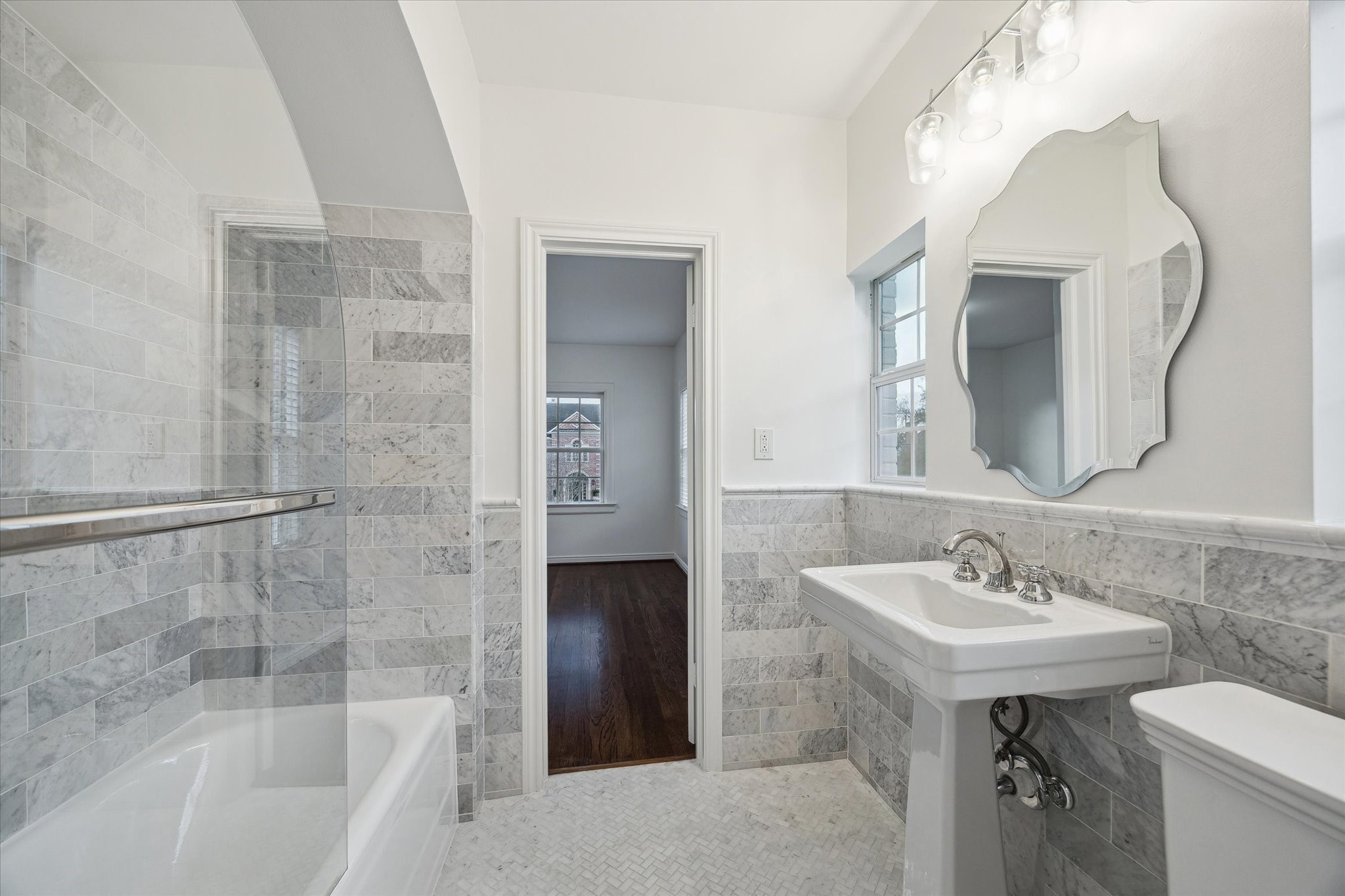 2440 Inwood Drive Houston, TX 77019 - Photo 20 of 25 a bathroom with a sink and a mirror