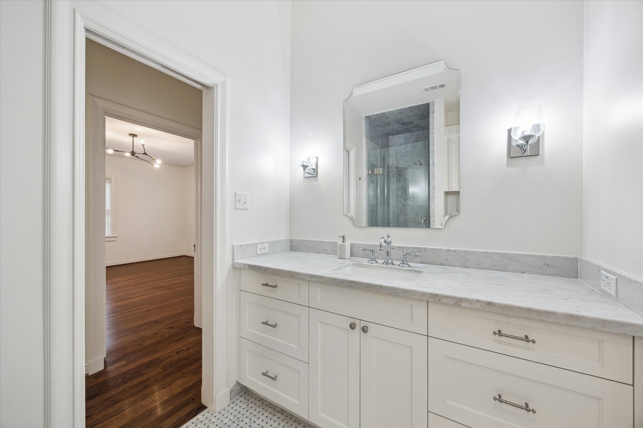 2440 Inwood Drive Houston, TX 77019 - Photo 21 of 25 a bathroom with a granite countertop sink vanity and mirror