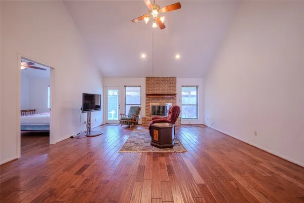 a kitchen with stainless steel appliances granite countertop a sink a stove and cabinets