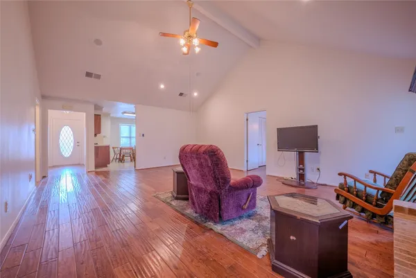 a kitchen with stainless steel appliances kitchen island granite countertop a stove sink and cabinets
