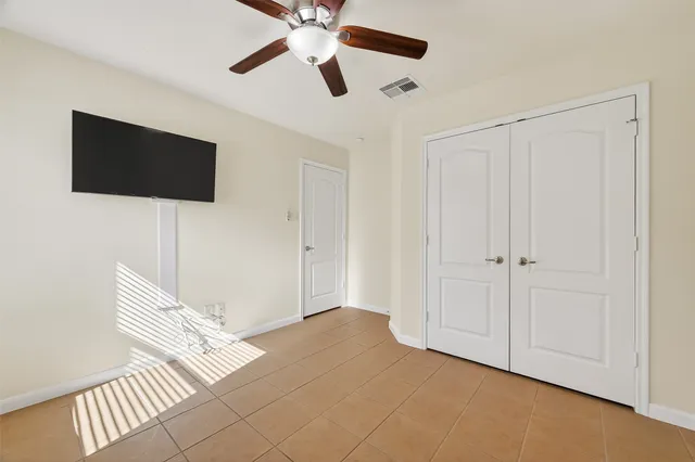 a view of an empty room with a flat screen tv