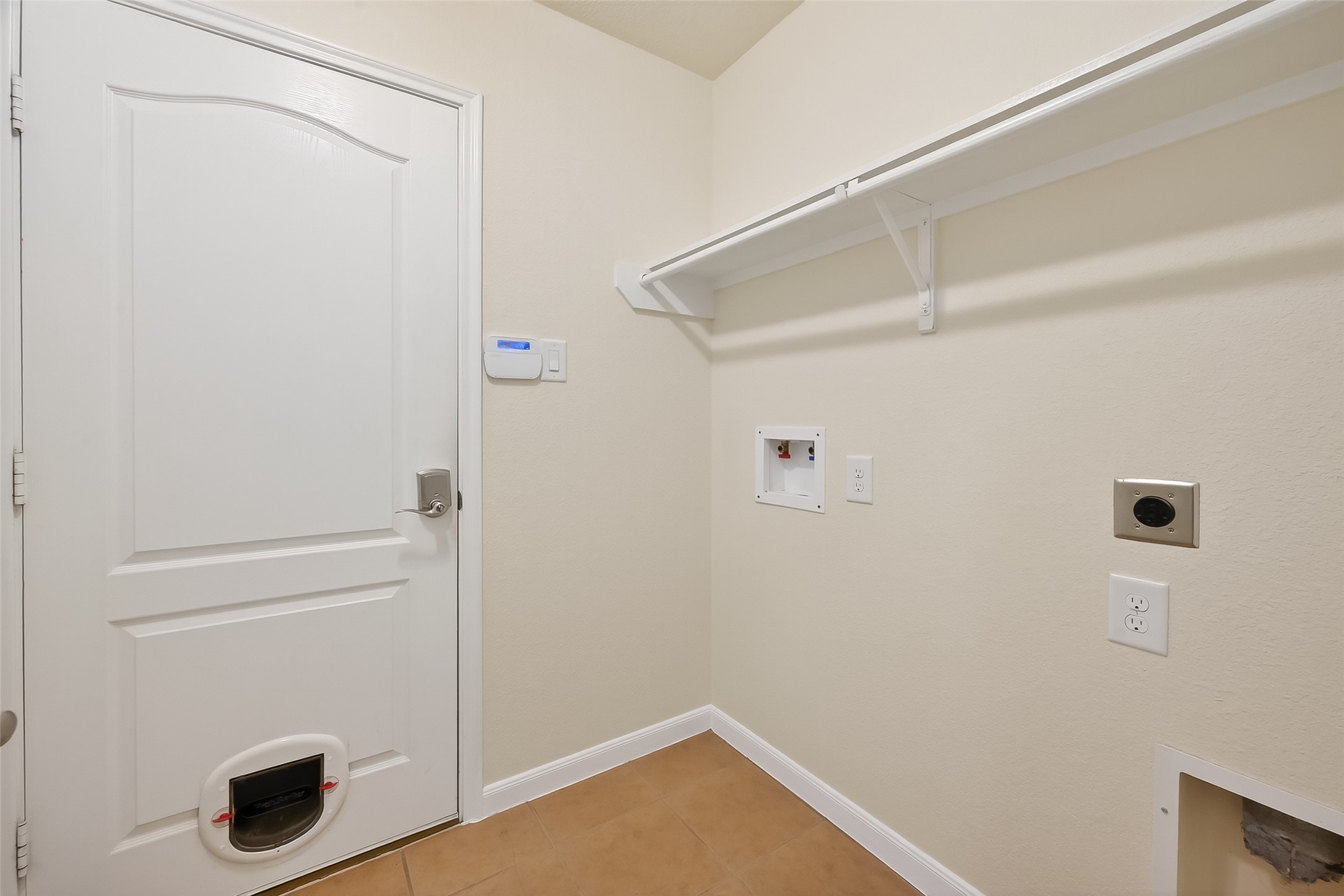 6722 Path Way Court Katy, TX 77449 - Photo 23 of 33 In house utility room with hanging bar & shelving