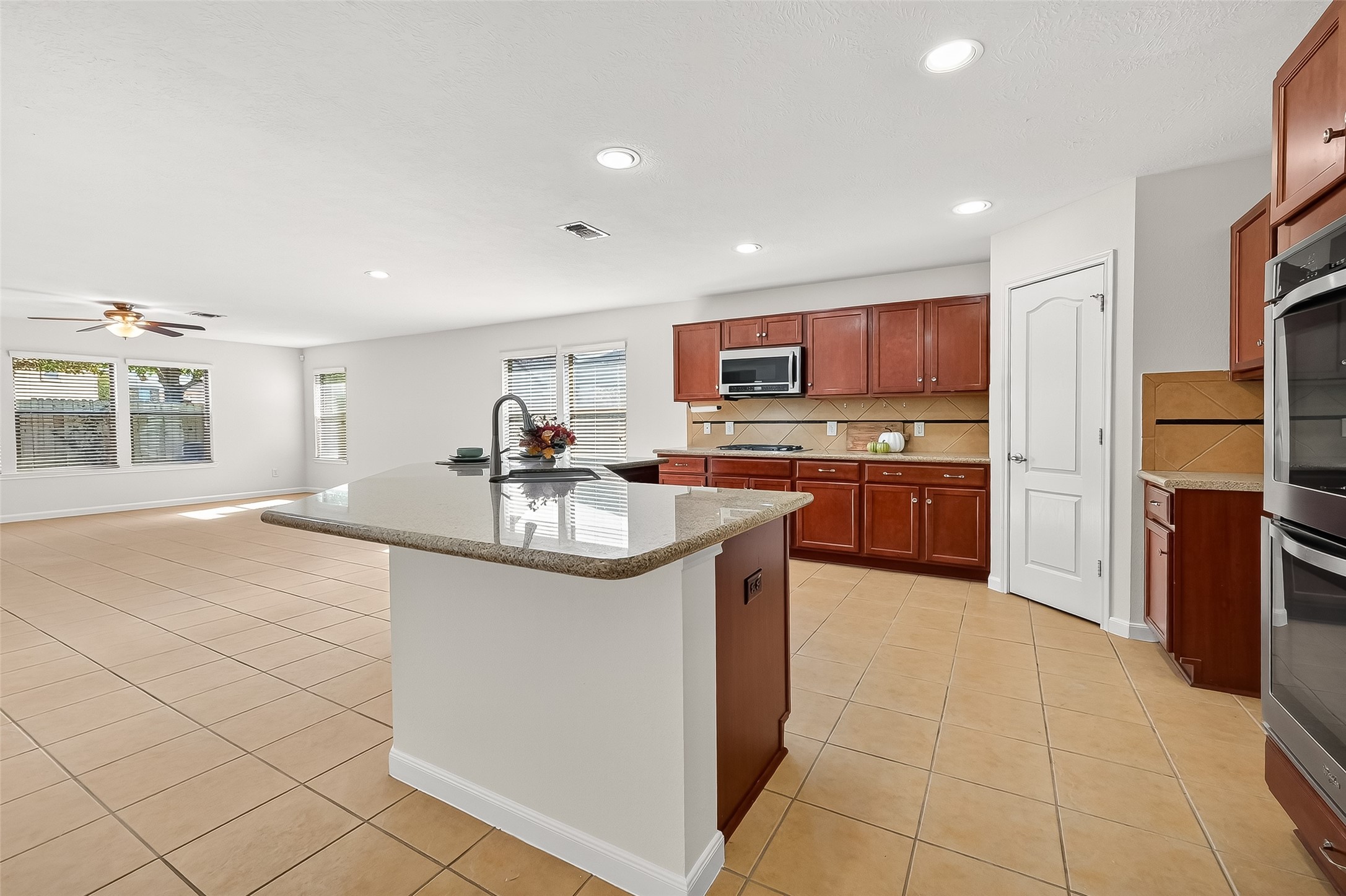 6722 Path Way Court Katy, TX 77449 - Photo 4 of 33 Granite countertops, walk-in pantry, gas stovetop, double oven, microwave