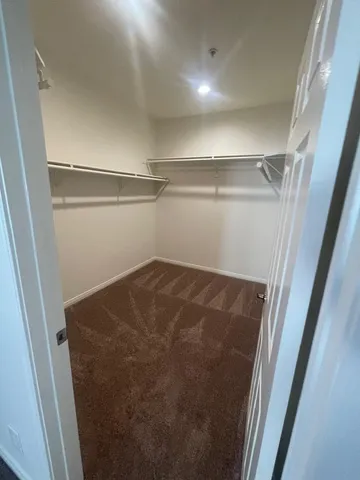 a large bathroom with a double vanity sink and mirror