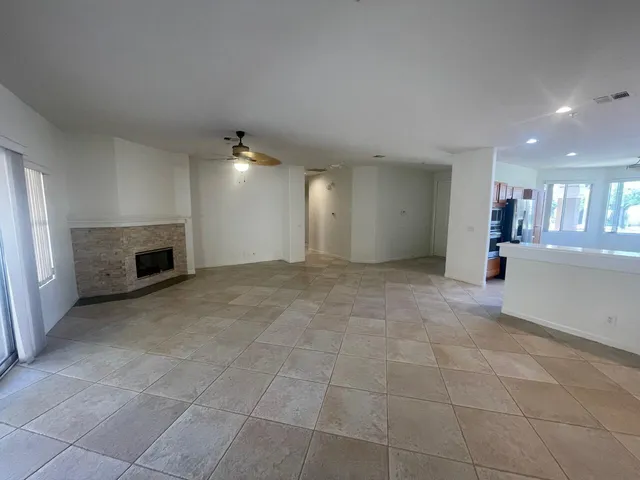 a view of a livingroom and a fireplace