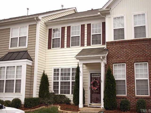 8262 City Loft Court Raleigh, NC 27613 - Photo 1 of 8 a front view of a house with a yard