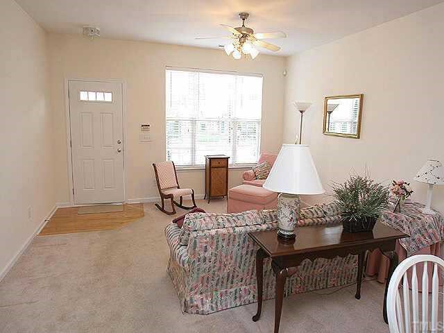 8262 City Loft Court Raleigh, NC 27613 - Photo 3 of 8 a view of a dining room with furniture window and outside view