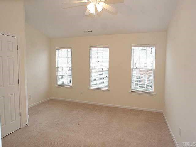 8262 City Loft Court Raleigh, NC 27613 - Photo 7 of 8 a view of an empty room with a window