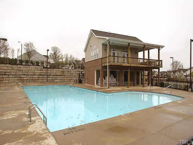8262 City Loft Court Raleigh, NC 27613 - Photo 8 of 8 a view of a house with a swimming pool