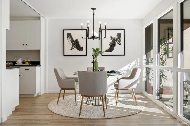 a dining room with furniture and window