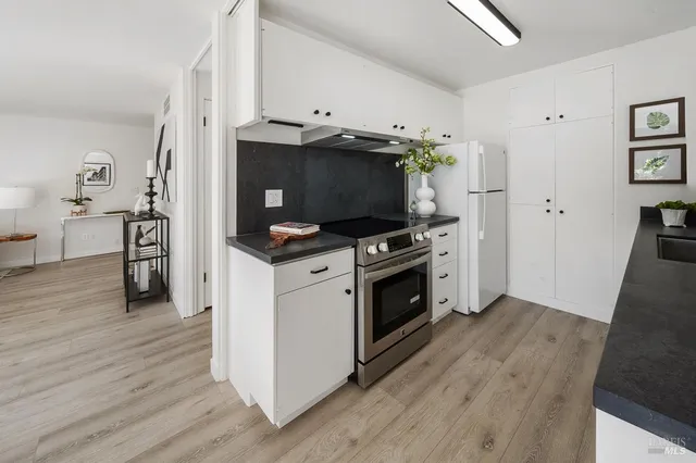 a view of kitchen and wooden floor