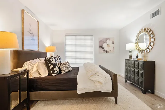 a bedroom with furniture and a window