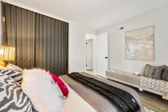 a bedroom with a bed and a couch