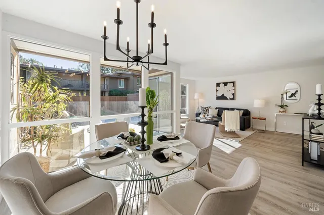 a view of a dining room with furniture window and outside view