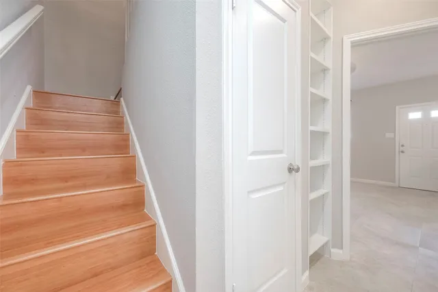 a view of staircase with white walls