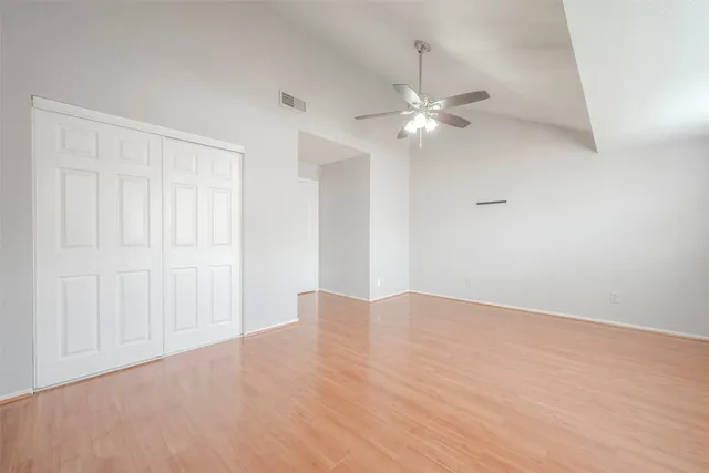 a view of an empty room with a fan