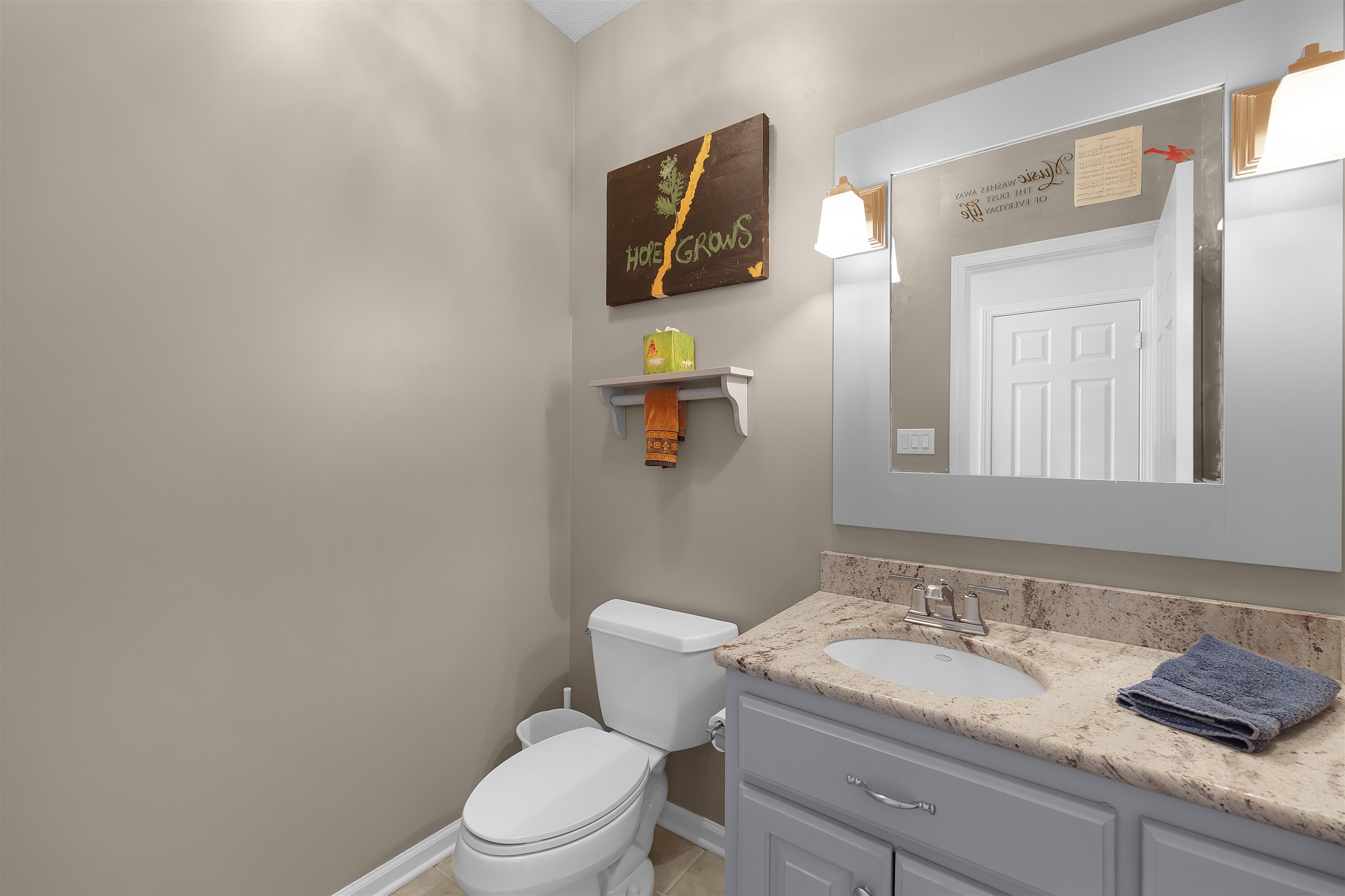 110 Falling Leaf Lane Counce, TN 38326 - Photo 21 of 31 a bathroom with a granite countertop toilet sink and mirror
