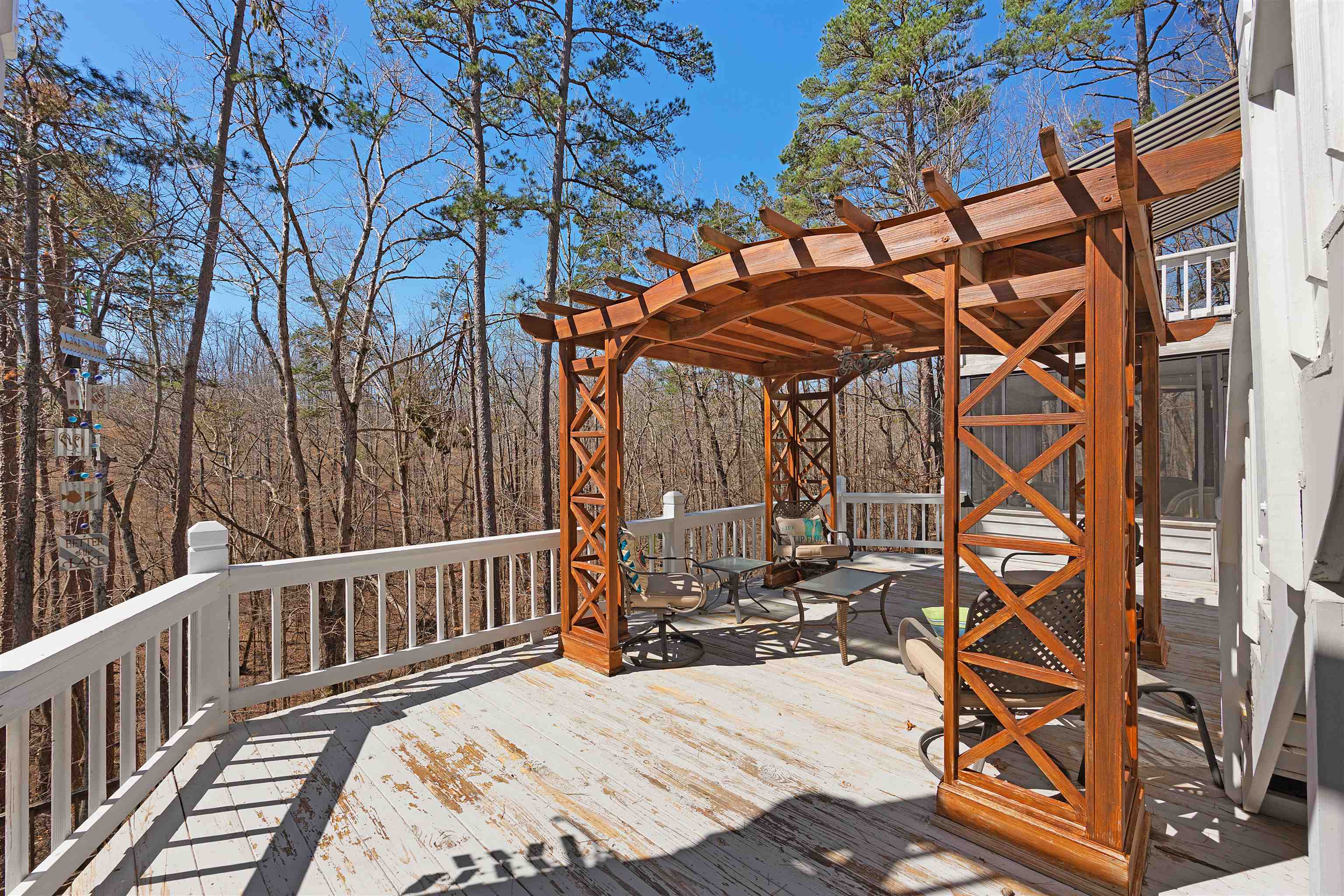 110 Falling Leaf Lane Counce, TN 38326 - Photo 25 of 31 a view of a patio with a table and chairs under an umbrella