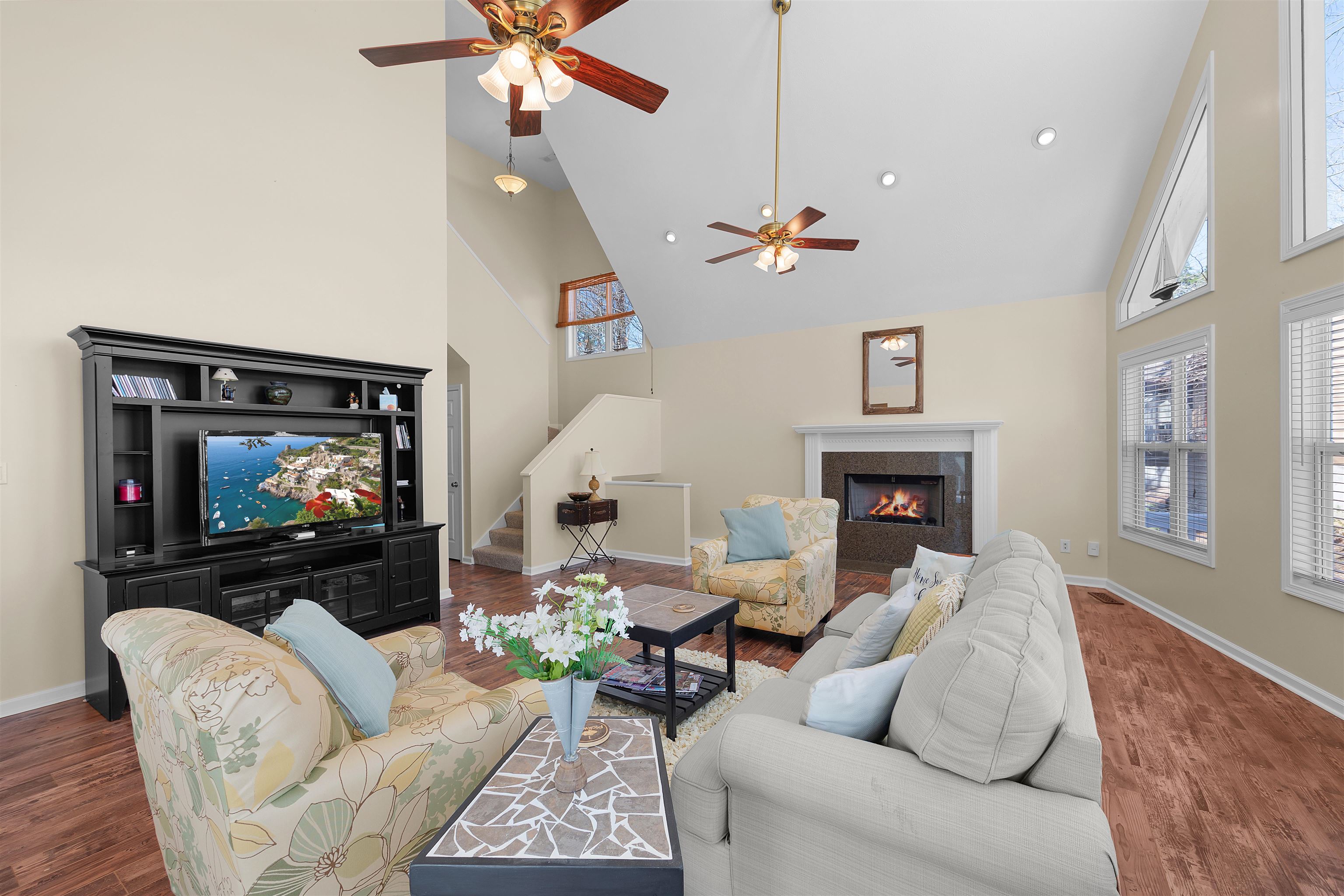 110 Falling Leaf Lane Counce, TN 38326 - Photo 6 of 31 a living room with furniture a fireplace and a flat screen tv