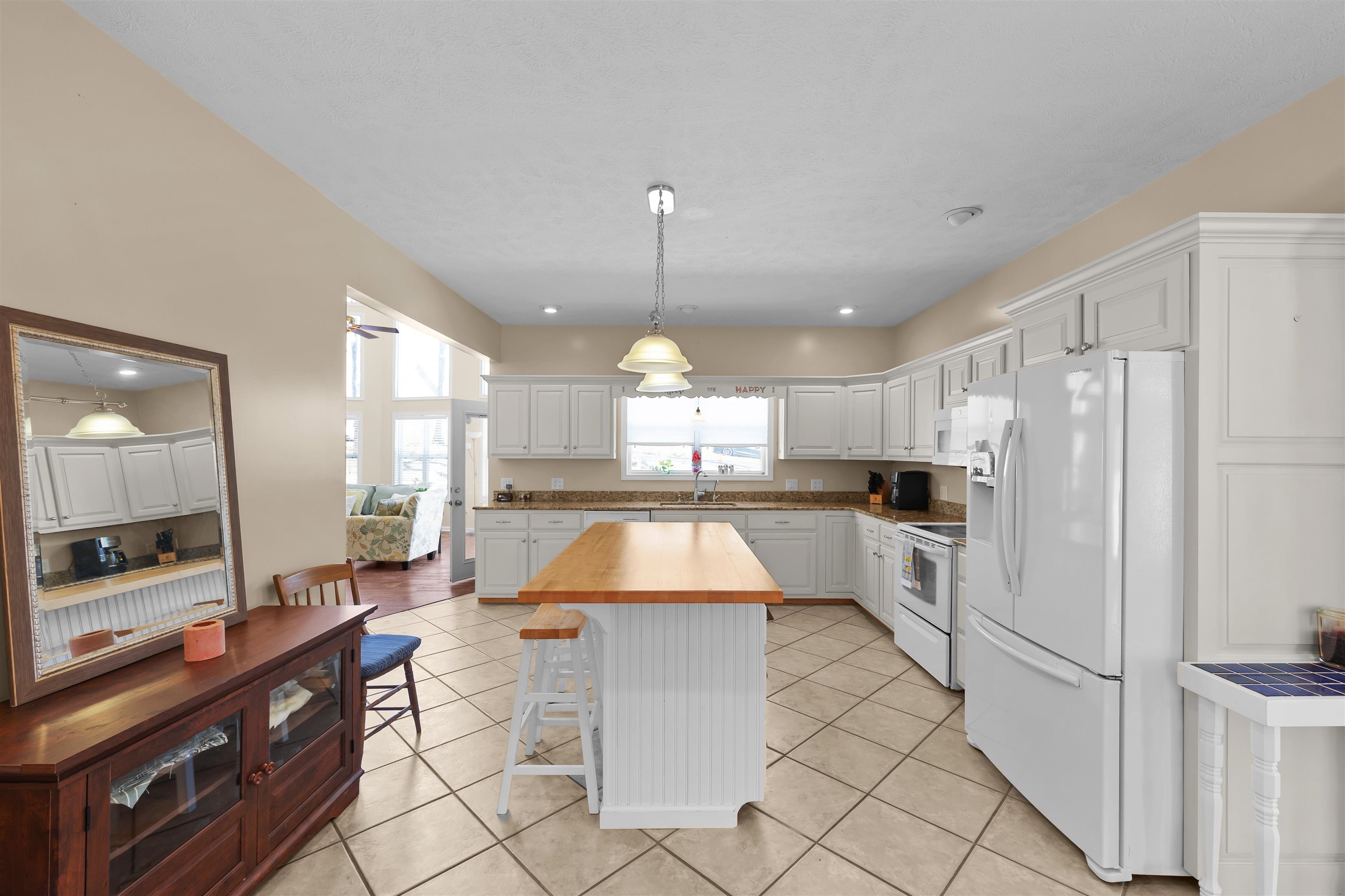 110 Falling Leaf Lane Counce, TN 38326 - Photo 8 of 31 a large kitchen with kitchen island a stove a counter space a sink and cabinets