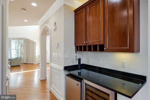 a kitchen with a sink stove and refrigerator