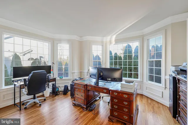 a bathroom with a sink vanity mirror and toilet
