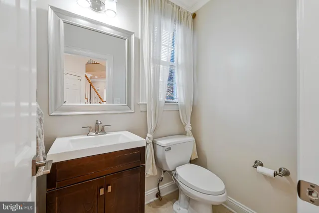 a view of a porch with wooden floor and stairs