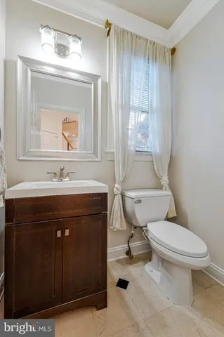 a bedroom with a large bed and a large window