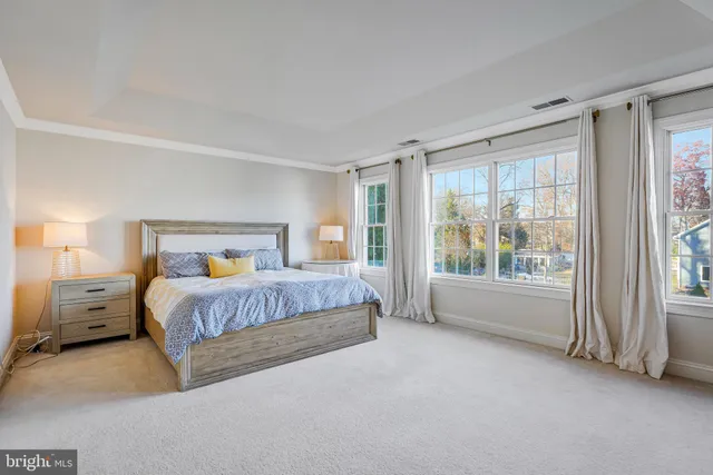 a living room with furniture flat screen tv and a fireplace