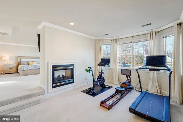 a bathroom with a tub shower and sink