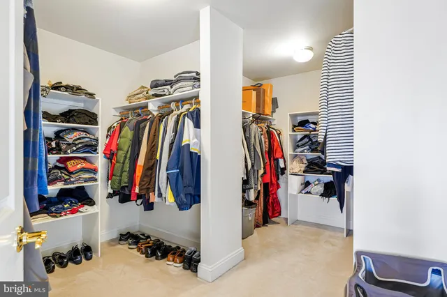 a bathroom with a sink a toilet a mirror and shower