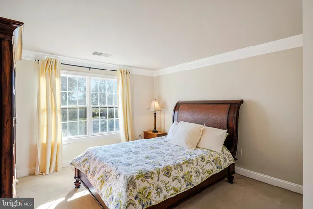 a bathroom with a sink a toilet a mirror and shower