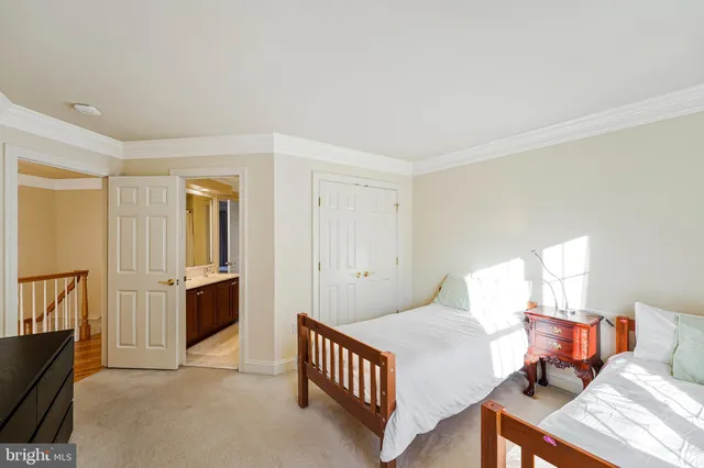 a bathroom with double vanity and a bathtub