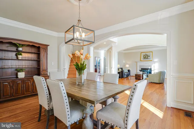 a kitchen with stainless steel appliances granite countertop a stove top oven a sink and a refrigerator