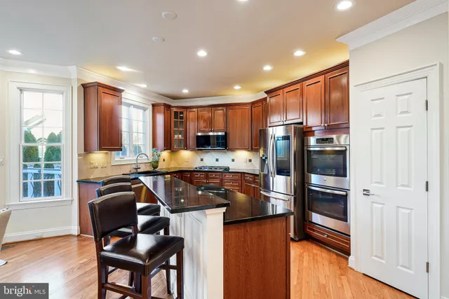 a kitchen with granite countertop a sink and cabinets