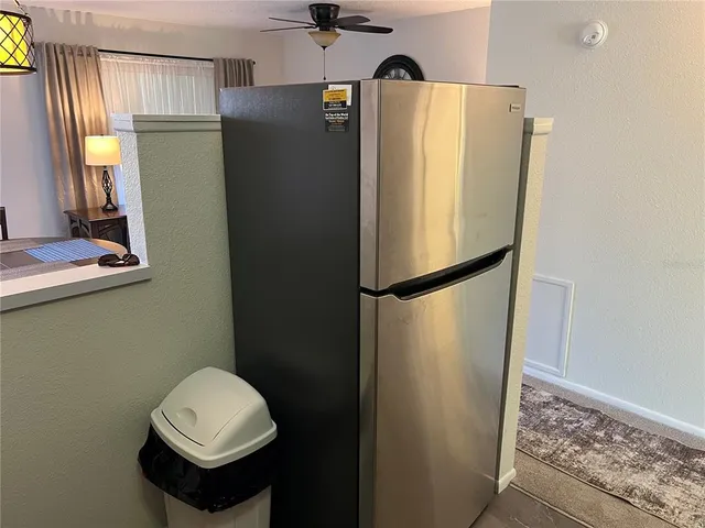 a bathroom with a sink a toilet a mirror and a shower